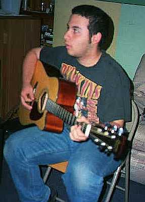 Dan playing accoustic in his basement